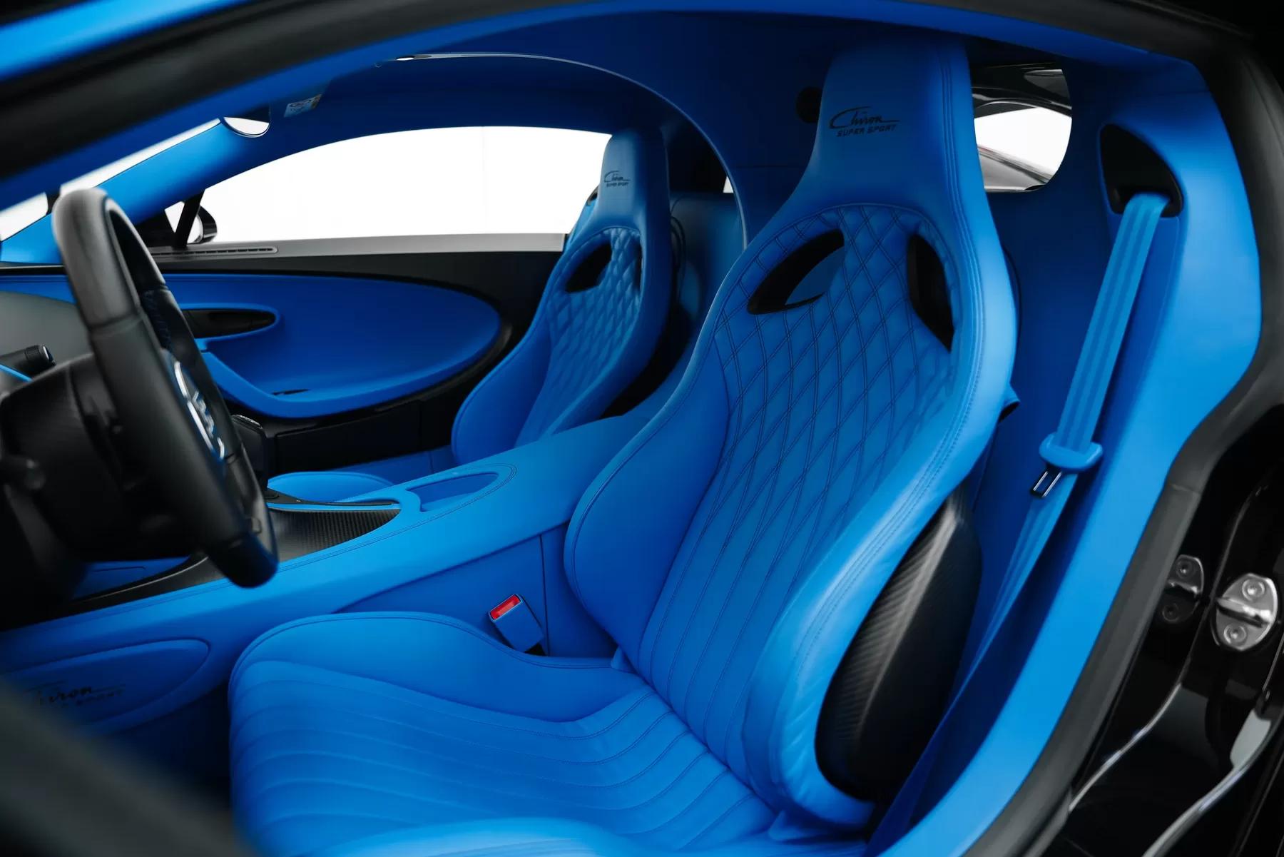 Bugatti Chiron Super Sport interior detail, near-black background.